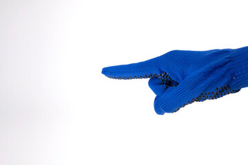 Hand gesture. The man points his finger. A hand in a blue glove points to a free space