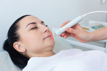 The use of a laser therapeutic device by a dermatologist during a cosmetic rejuvenation procedure...
