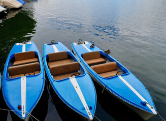 Blue canoes in Bregenz harbor, Lake of Constance. Vorarlberg, Austria.