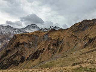 beautiful autumn hike in the beautiful swiss mountains Panorama picture with the first snow.Mountain peaks full of snow