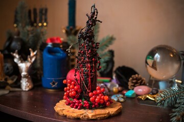 Altar of wicca, candle, magic books and other witch stuff. Mystic background with ritual esoteric objects, occult, fortune telling and Halloween concept