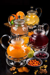 Assortment set of autumn teas with fresh fruit, homemade teas with citrus and berrie
