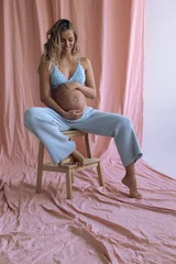 beautiful pregnant woman with blond hair posing in studio © dariyad
