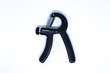 Original name(s): Flat Lay Shot of A Black Hand Grip Tool in The Minimalist White Background, Landscape Mode