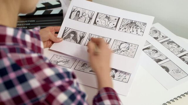 The artist draws a storyboard for the film. The director creates the storytelling by sketching footage of the script on paper.