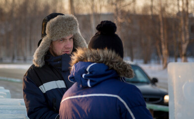 Two workers at the site of the ice camp