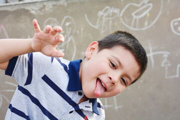 Funny little latin boy outside.