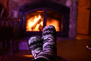 Warming up in front of fireplace