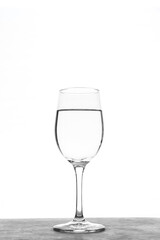 Vertical Glass of water isolated on white background.Transparent glass of water on light background