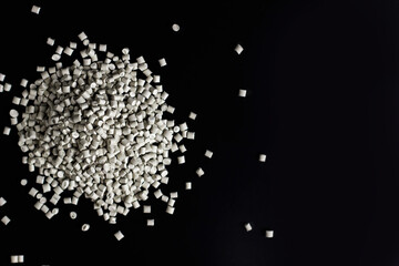 Many white, grey granules of polypropylene, polyamide. Background. Plastic and polymer industry,...