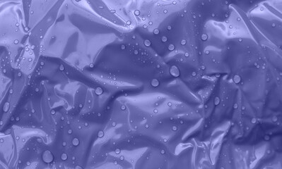 Crumpled background and water drops in trend shading for the year 2022 very peri