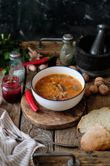 Kharcho. Spicy soup with beef, walnuts, tkemali, garlic and cilantro. Side view.