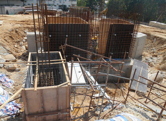 KUALA LUMPUR, MALAYSIA -SEPTEMBER 6, 2019: Pile cap steel reinforcement bar under construction at the construction site. Mold by using plywood formwork and then concrete will be poured into it.
