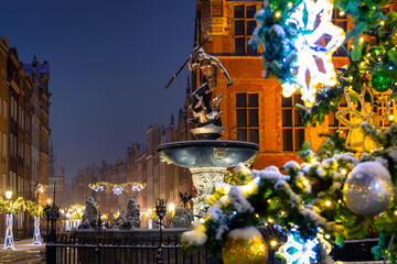 Beautiful Christmas tree and Neptune's Fountain in Gdansk at winter. Poland