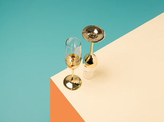 Champagne glasses on a geometric colorful pastel background. New Year party minimal concept