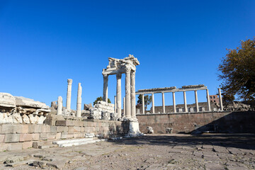 beautiful temple of Trajan with white marble columns on blue sky background, ancient city Pergamon,...