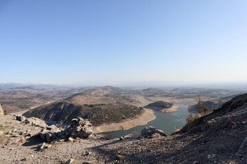 view to Kestel dam lake reservoir in the mountains from Pergamon acropolis, Turkey