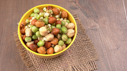 Healthy diet and vegetarian food. Mix of fresh sprouts on beautiful background. macrobiotic food. Sprouted wheat, peas, lentil seeds. Copy space 