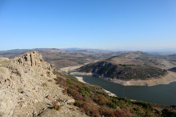 view to Kestel dam lake reservoir in the mountains from Pergamon acropolis, Turkey