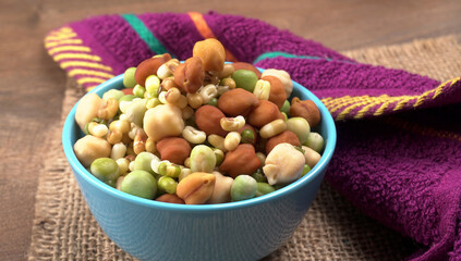 Healthy diet and vegetarian food. Mix of fresh sprouts on beautiful background. macrobiotic food. Sprouted wheat, peas, lentil seeds. Copy space 