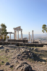 beautiful temple of Trajan autumn view with white marble columns with blue sky and valley...