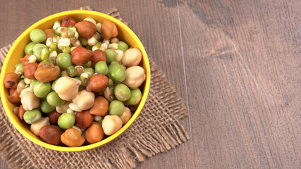 Healthy diet and vegetarian food. Mix of fresh sprouts on beautiful background. macrobiotic food. Sprouted wheat, peas, lentil seeds. Copy space 