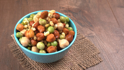 Healthy diet and vegetarian food. Mix of fresh sprouts on beautiful background. macrobiotic food. Sprouted wheat, peas, lentil seeds. Copy space 