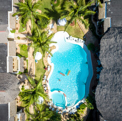 Top view of pool in tropical resort.