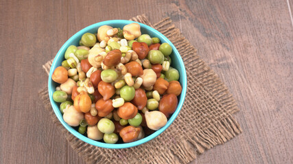 Healthy diet and vegetarian food. Mix of fresh sprouts on beautiful background. macrobiotic food. Sprouted wheat, peas, lentil seeds. Copy space 