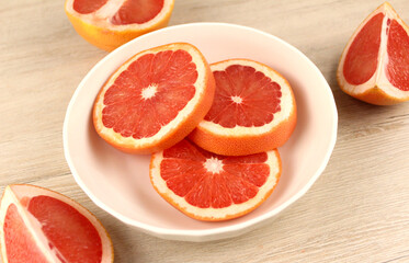 Sliced grapefruit in a white plate