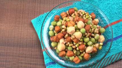 Healthy diet and vegetarian food. Mix of fresh sprouts on beautiful background. macrobiotic food. Sprouted wheat, peas, lentil seeds. Copy space 
