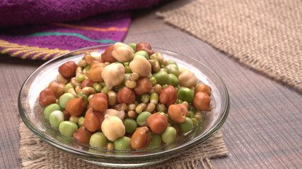 Healthy diet and vegetarian food. Mix of fresh sprouts on beautiful background. macrobiotic food. Sprouted wheat, peas, lentil seeds. Copy space 
