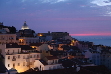 Cityscape Image of Lisbon, Portugal during dramatic sunrise.