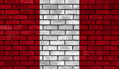 Peru flag on a brick wall