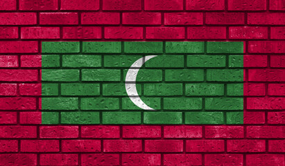 Maldives flag on a brick wall