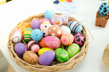 Fototapeta na wymiar Colorful easter eggs in Basket