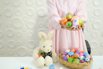 Portrait beautiful young asia girl with painted eggs, Happy easter day