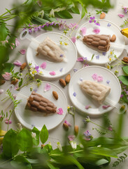 Vegan vanilla and chocolate ice cream on gray background made from almond milk