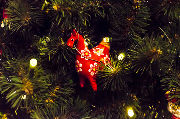 little red horse christmas decoration on the tree