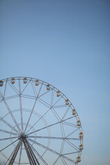 Ferris wheel in winter against the blue sky.