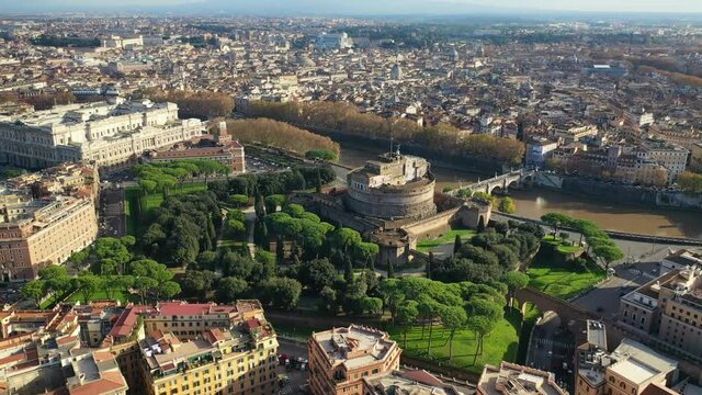 Aerial drone rotational video of iconic Castel Sant'Angelo a fortified medieval castle housing paintings collections in Renaissance style, historic city of Rome, Italy