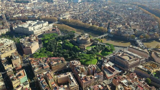 Aerial drone rotational video of iconic Castel Sant'Angelo a fortified medieval castle housing paintings collections in Renaissance style, historic city of Rome, Italy