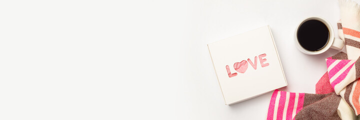 Gift box, coffee cup and scarf on a light background. Composition Valentine's Day. Banner. Flat lay, top view © Alex
