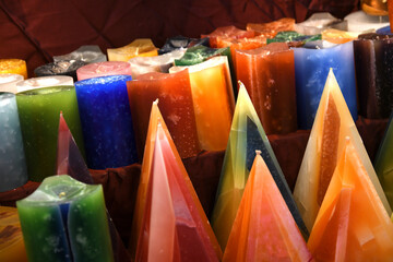 colored candles in a christmas market