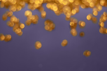 blurred golden lights on a purple background