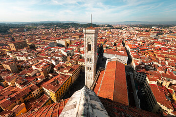 High view from Santa Maria del Fiore cathedral with a wide view of the Giotto's Bell Tower and the city of Firenze, Tuscany, Italy.