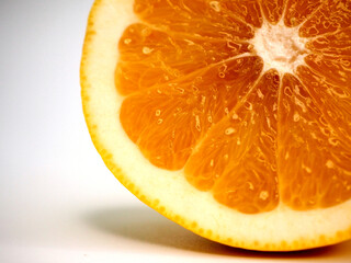 Cut white grapefruit, juicy yellow flesh. Close-up