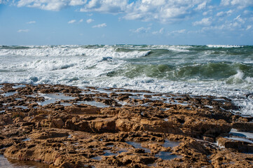 A strong November wind drives roaring waves to the shore, tearing white foam from them. All the beaches of Paphos and nearby villages are flooded with stormy waters.       