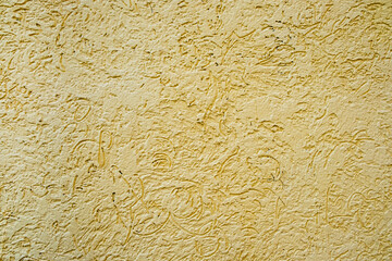 Vibrant painted yellow old wall texture background