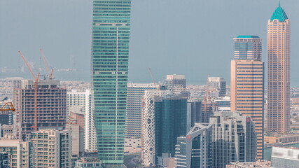 Fototapeta na wymiar Skyline with modern architecture of Dubai business bay towers timelapse. Aerial view